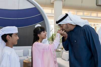 President Sheikh Mohamed greets Reem Al Neyadi, daughter of Dr Al Neyadi, during the homecoming reception. Photo: UAE Presidential Court 