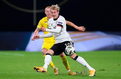 Germany midfielder Julian Brandt and Ukraine defender Yukhym Konoplia vie for the ball. AFP