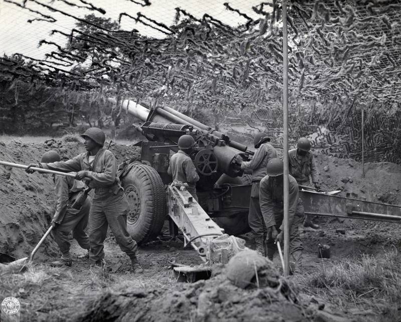Troops of a field artillery battery emplace a howitzer in France, following the advance of the infantry and are setting up a new position. in 1944. Getty Images
