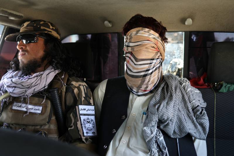 A suspected ISIS member sits blindfolded in a Taliban Special Forces' car in Kabul on September 5, 2021. Reuters