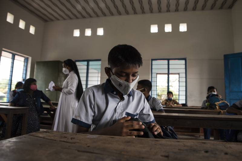 Child wearing masks in their classroom.