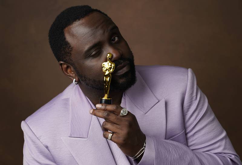 Brian Tyree Henry with a miniature Oscar statuette. AP