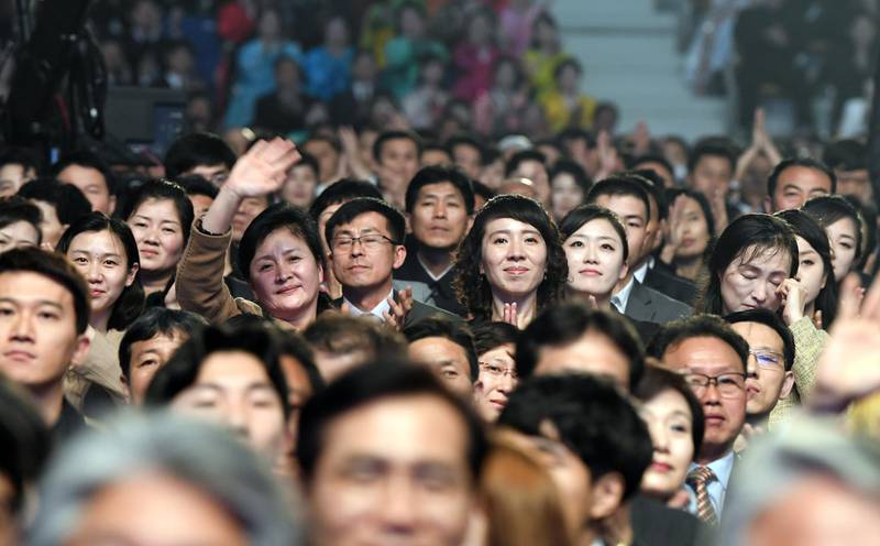 North Koreans watch a performance of a South Korean and North Korean art troupe during a joint inter-Korean concert. EPA / Korea Pool