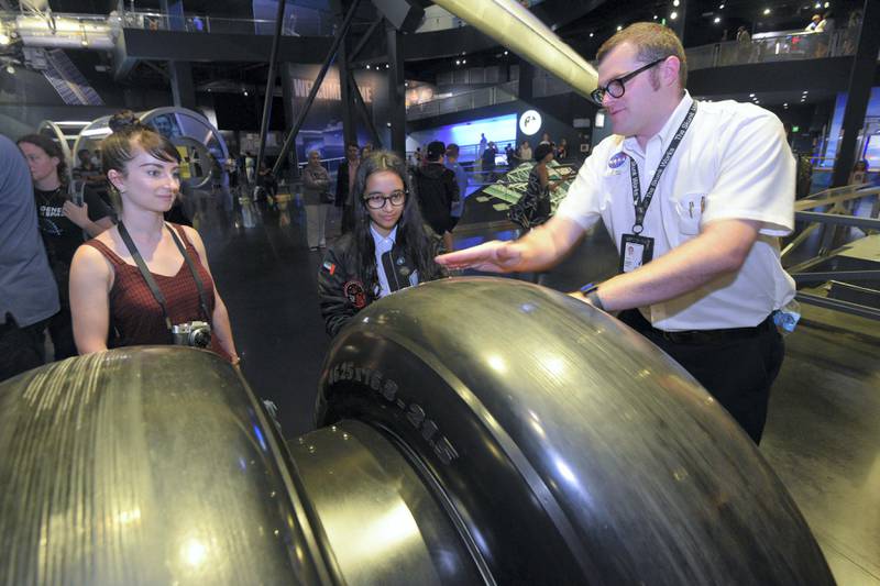 Alia Al Mansoori looks at the wheel from the final Space Shuttle mission while touring the Space Shuttle Atlantis exhibit at the Kennedy Space Center Visitor's Center on Aug. 11, 2017 in {town}, Florida. Al Mansoori's Genes in Space experiment is scheduled to be on a SpaceX Falcon 9 rocket traveling to the International Space Station from Kennedy Space Center.(Scott A. Miller for The National)