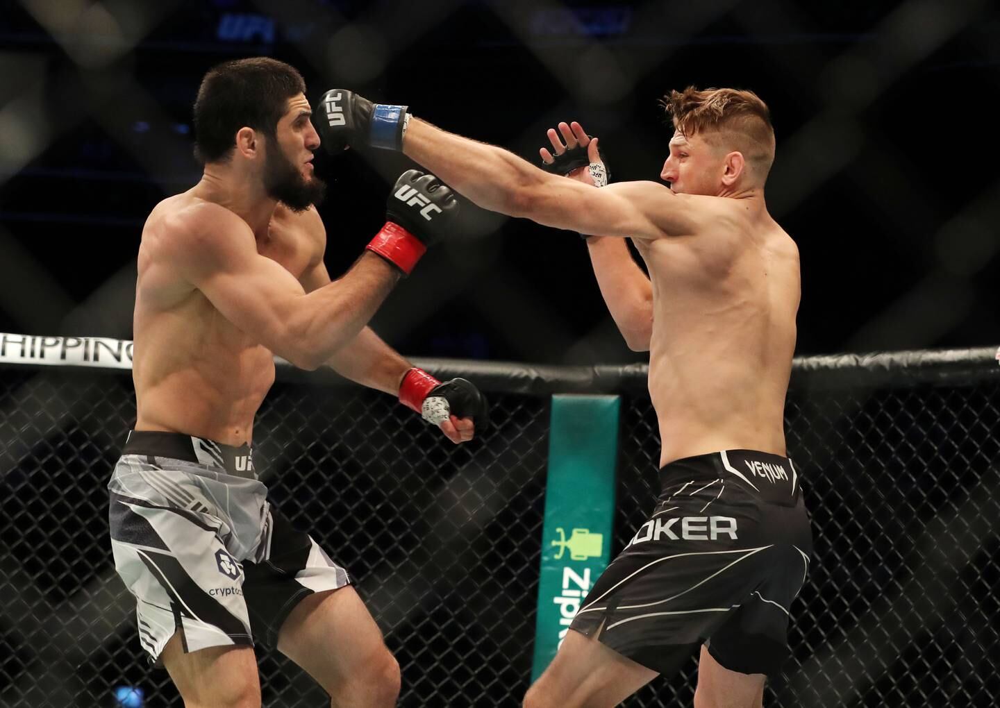 Islam Makhachev (l) beats Dan Hooker at UFC 267 on Yas Island, Abu Dhabi, in October 2021. Chris Whiteoak / The National
