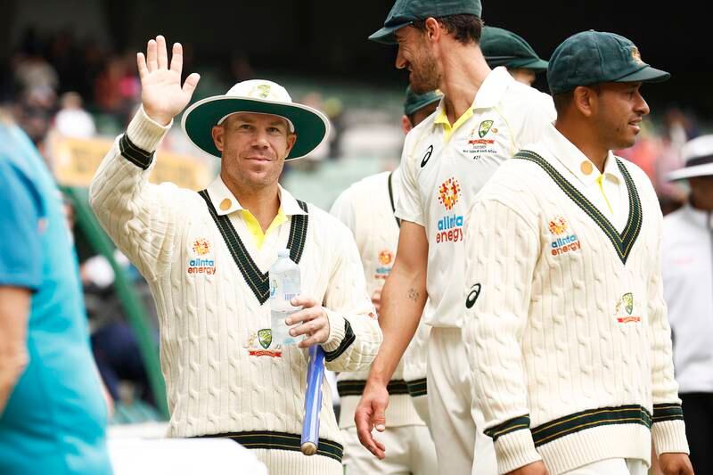 David Warner waves to his family in the stands at the conclusion of day four of the second Test between Australia and South Africa. Getty