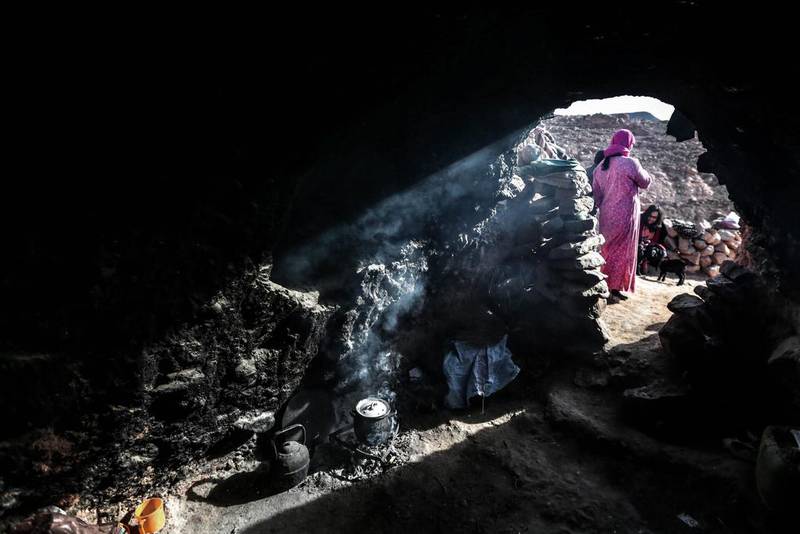 Aesha, 45, and her family live in this cave in the desert of the Anti-Atlas mountains, east of Ourazazate, Morocco.