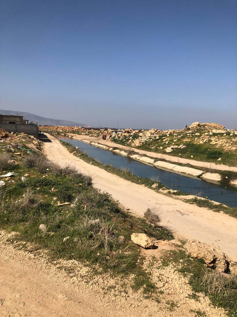 A narrow water channel forms the border with Syria in Lebanon's Baalbek-Hermel region. Aya Iskandarani / The National