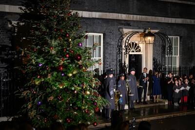Mr Sunak and his wife outside No 10 as the Christmas lights are turned on. Getty Images