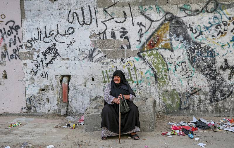 A Palestinian eldrely refugee woman sits outside her house in the streets of Khan Younis refugee camp in the Gaza Strip.  World Refugee Day is marked on 20 June each year to highlight the suffering of the tens of millions of people forced to flee their homes due to war or persecution. Nearly one-third of the registered Palestine refugees, more than 1.5 million individuals, live in 58 recognized Palestine refugee camps in Jordan, Lebanon, the Syrian Arab Republic, the Gaza Strip and the West Bank, including East Jerusalem.  EPA