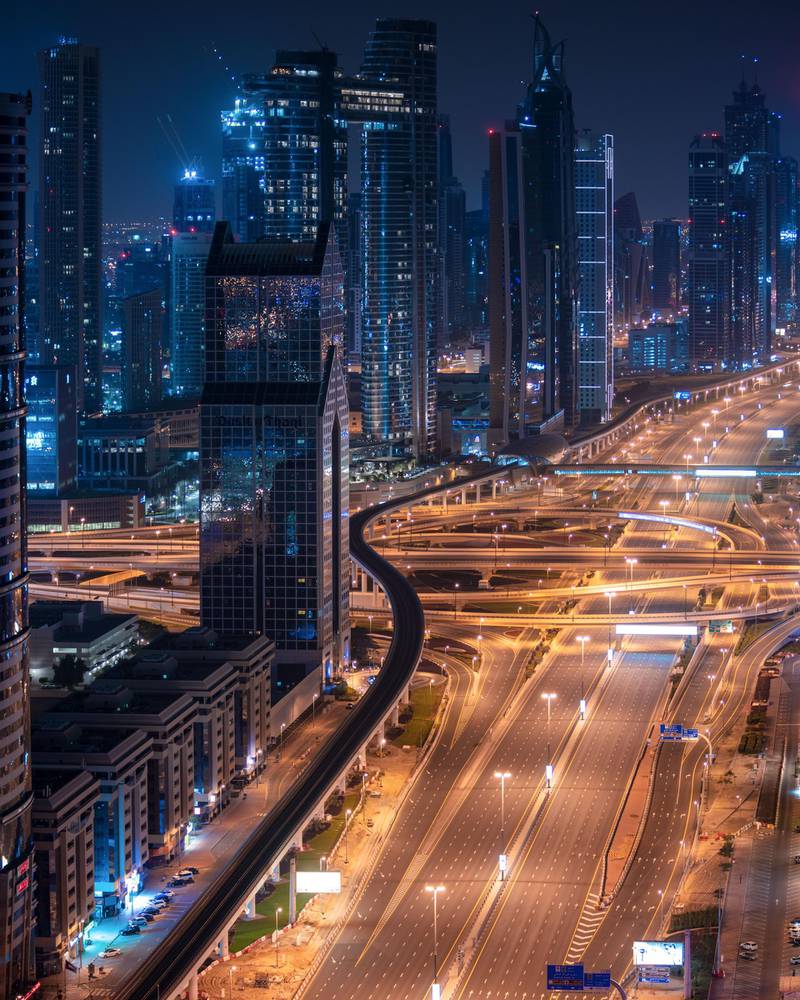 'Deserted Sheikh Zayed road with an empty interchange', by Haytham El Achkar