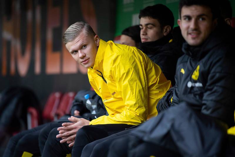 Erling Haaland sits on the bench during the game between Dortmund and Augsburg. AP