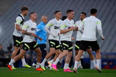 Manchester City players warm up at the Ataturk Olympic Stadium in Istanbul. AP
