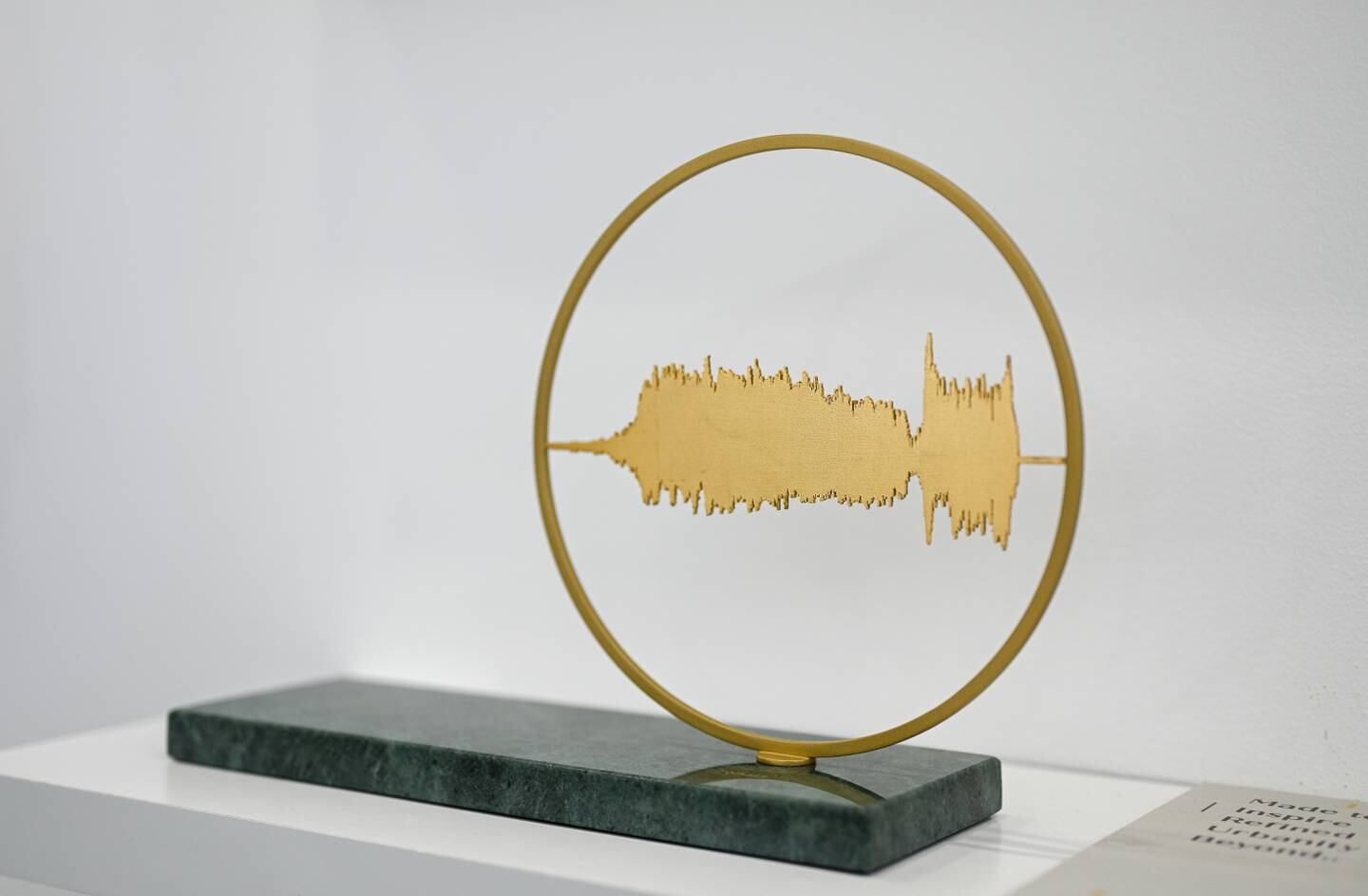 Sara Al Harbali’s steel and gold leaf wall sculptures from the Revelation Spectogram Collection, which transmutes Quranic verse into sound waves. It's part of UAE Designer Exhibition at Dubai Design Week. Photo: the artist and Dubai Design Week