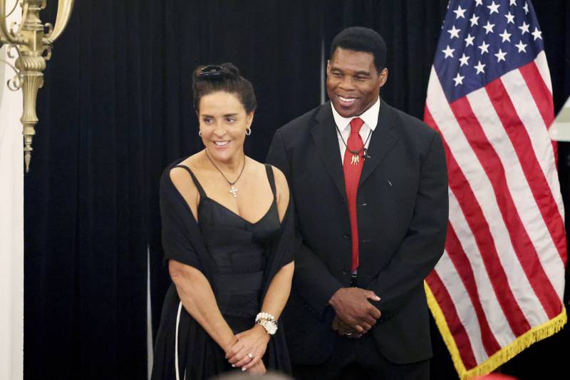 Herschel Walker with his wife Julie celebrating his Republican primary win in Atlanta, Georgia. AP