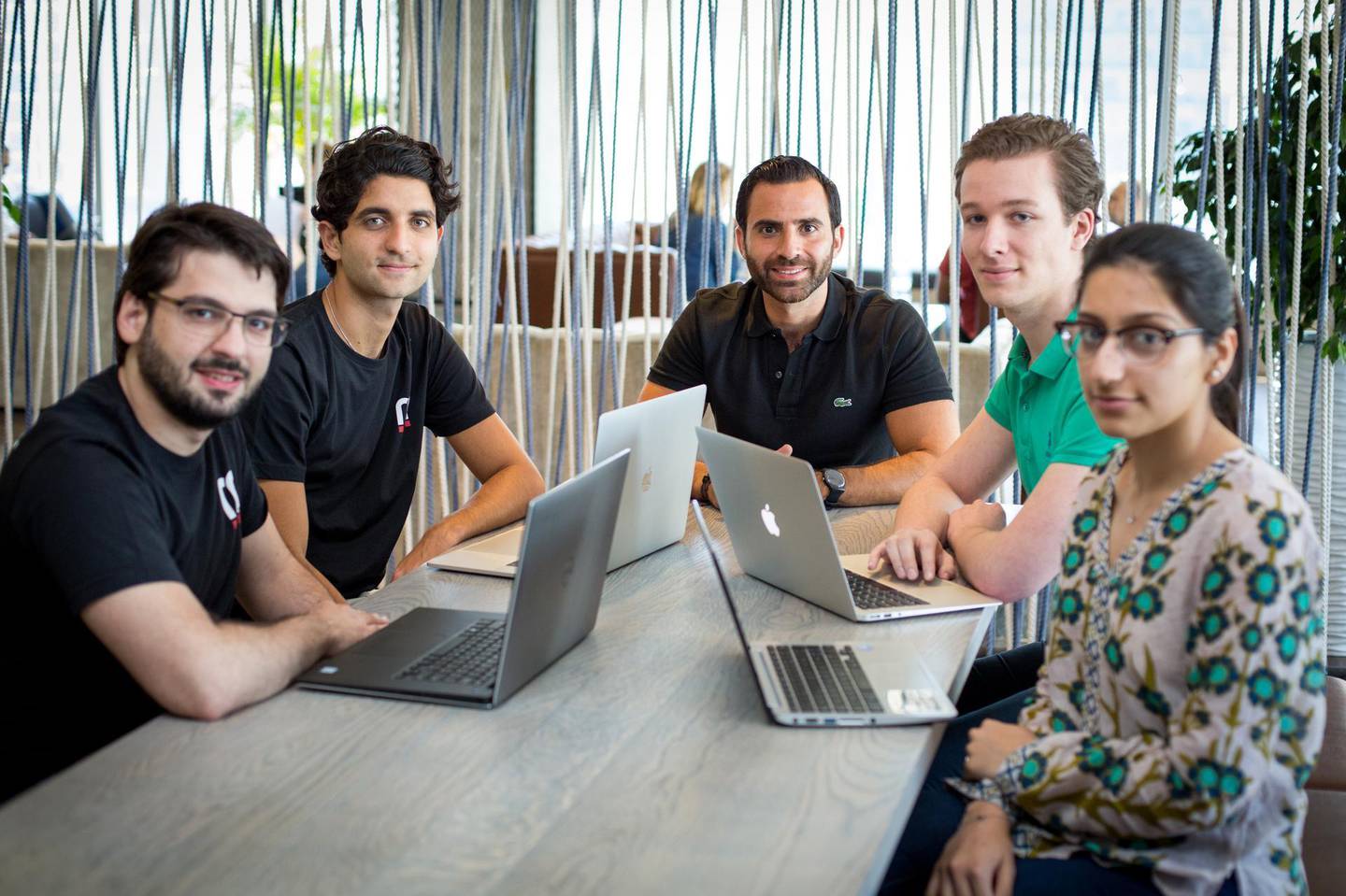 Philip Bahoshy (centre) with his team at Magnitt. The entrepreneur plans to hire new tech experts to help grow the platform. Photo: Magnitt