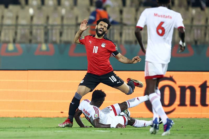 Sudan's Mazin Mohamedein Alnour Mohamed tackles Egypt's Mohamed Salah. AFP