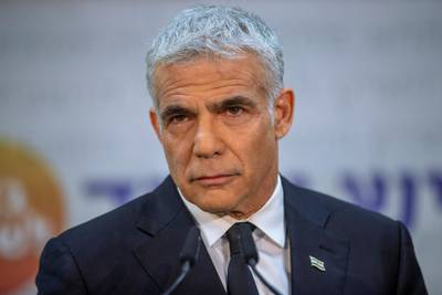 FILE - In this May 6, 2021, file photo, Israeli opposition leader Yair Lapid listens during a news conference in Tel Aviv, Israel. Prime Minister Benjamin Netanyahu's opponents on Wednesday, June 2, were racing to finalize a coalition government to end his 12-year rule â€” the longest by any Israeli premier â€” ahead of a midnight deadline. Centrist Lapid and ultranationalist Naftali Bennett have joined forces and agreed to rotate the premiership between them, with Bennett going first, but are still working to cobble together a ruling coalition that would include parties from across the political spectrum. (AP Photo/Oded Balilty, File)