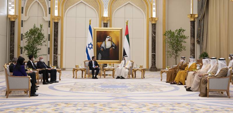 Sheikh Mohamed bin Zayed and the Israeli delegation talk at Qasr Al Watan. Mohamed Al Hammadi / Ministry of Presidential Affairs