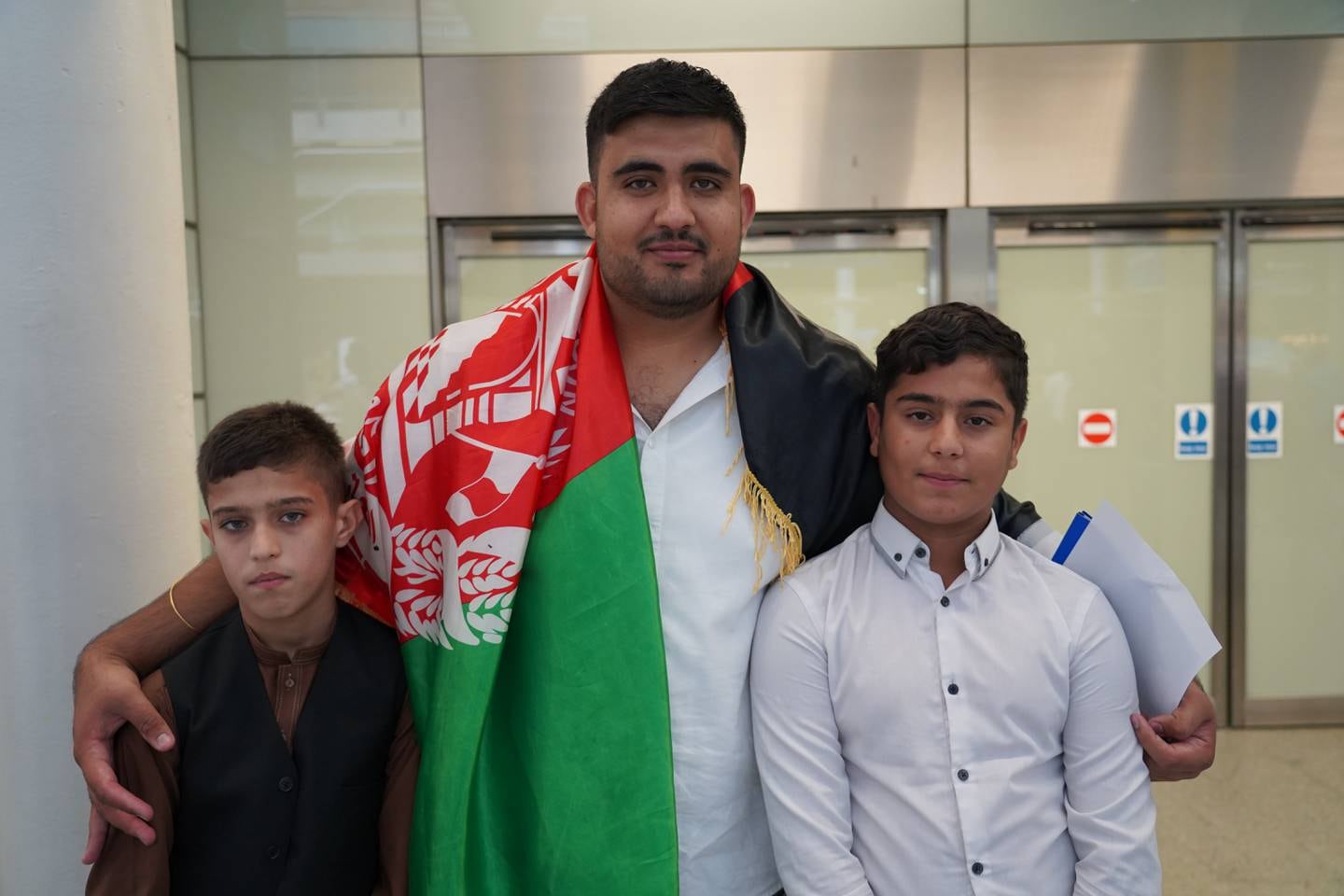 Qamar Jabarkhyl and his cousins, Irfanullah and Obaidullah Jabarkhyl, at St Pancras in London. The boys were separated a year ago during the evacuation of Kabul. Amy McConaughy / The National