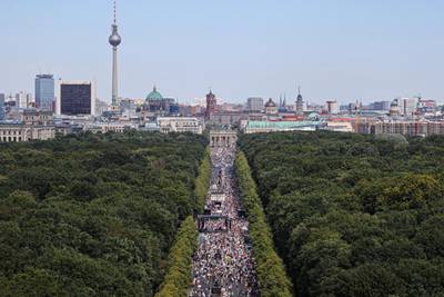 A general view shows a protest near the Brandenburg Gate against the government's restrictions amid the coronavirus disease (COVID-19) outbreak, in Berlin, Germany. REUTERS