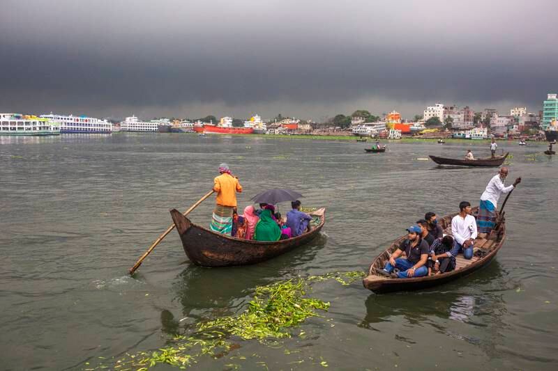 Dark storm clouds gather over the Buriganga River in Dhaka. EPA