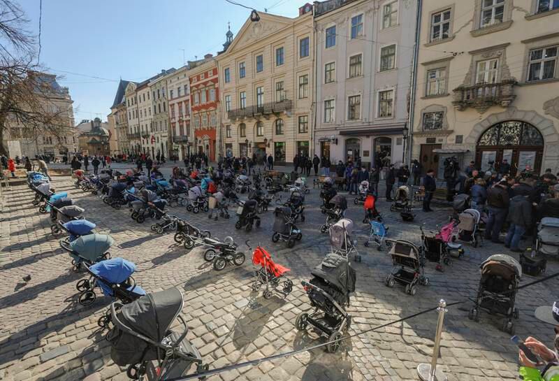 More than 100 baby carriages from an  installation named 'The price of war' in the Western Ukrainian city of Lviv to signify the more than 100 children who have been killed during the Russian invasion. EPA
