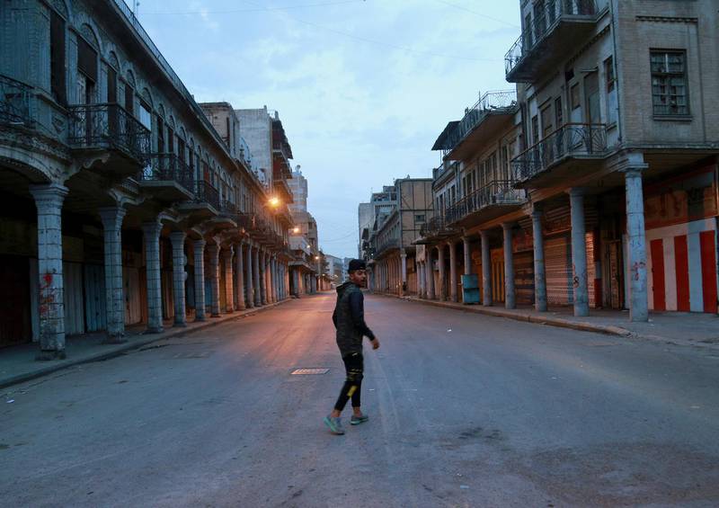 A man walks down an empty street in central Baghdad, Iraq. AP Photo