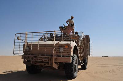 An Emirati soldier checks the gun atop an armoured vehicle at a military base near Saffer in Yemen’s Marib province. Adam Schreck / AP