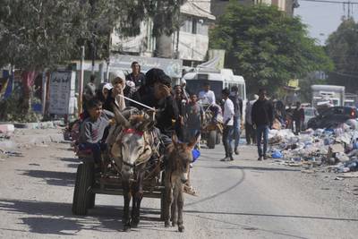 Palestinians flee from northern Gaza to the south after the Israeli army issued an evacuation warning. AP