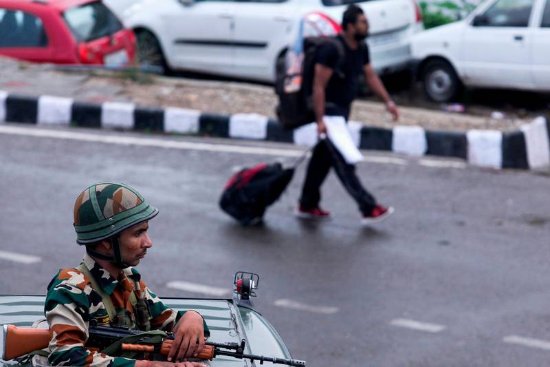 Security personnel stand guard a street in Jammu on August 5, 2019. AFP