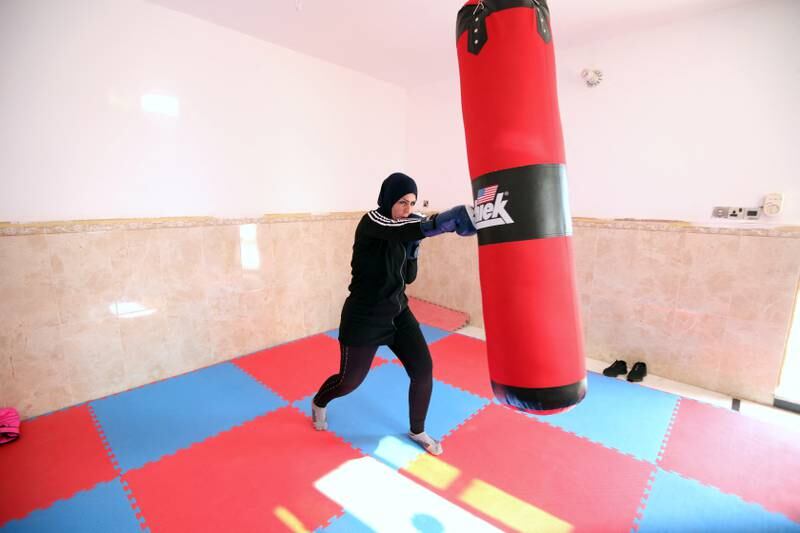 Bushra Abdul Zahra in action during a training session at her home in Najaf.