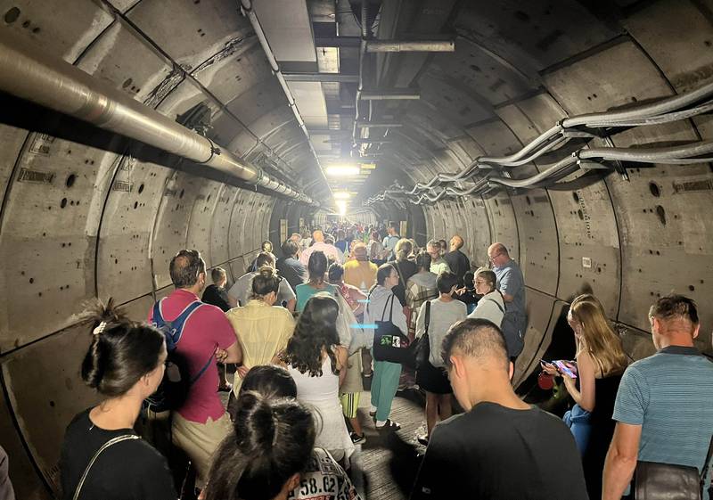 Passengers are forced to wait in an emergency service tunnel under the English Channel after a train from Calais to Folkestone broke down. Photo: Twitter / Kate Scott