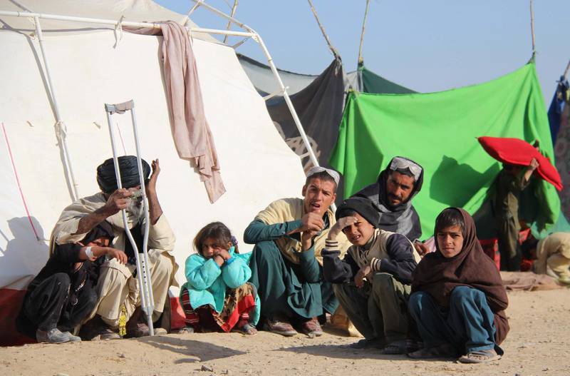 epa08839398 Families who fled their villages after Taliban launched massive attacks in different districts of Helmand province, live in temporary shelters in provincial capital Lashkargah, Helmand, Afghanistan, 24 November 2020.  Violence has surged across the country in recent weeks, despite the Afghan government and the Taliban committing to be on the defensive to help the ongoing intra-Afghan peace talks that are underway in Doha for over a month.  EPA/WATAN YAR