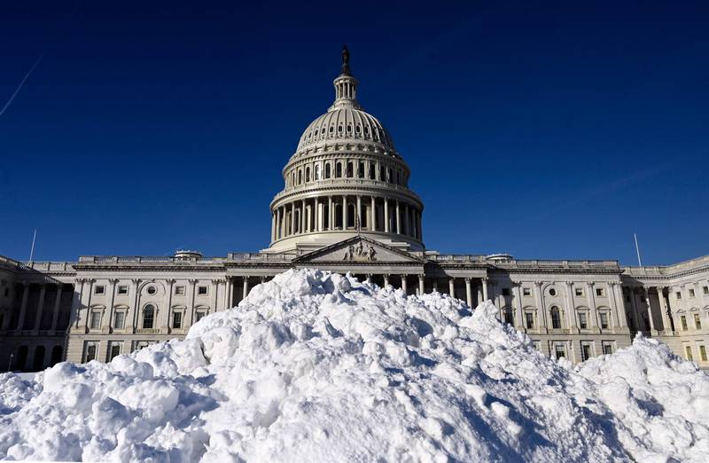 Snow is piled on the east side of the US Capitol a day after a snow storm in Washington. AFP