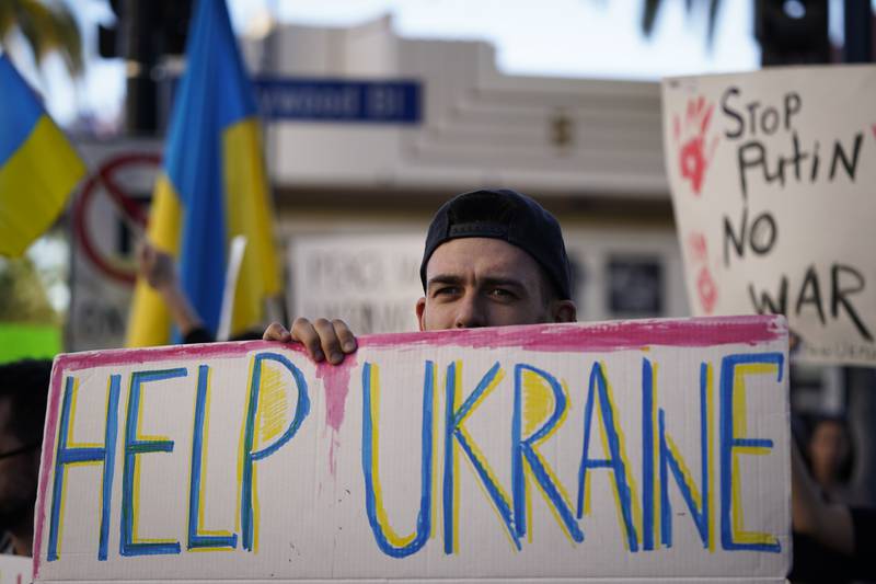 Dmytro Stasyshen of Ukraine holds a sign to protest the Russian invasion during a rally in the Hollywood area of Los Angeles. AP
