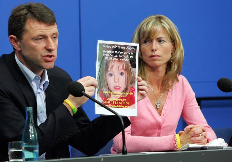 Kate and Gerry McCann display a poster of their missing daughter Madeleine at a press conference in June 2007, a month after she disappeared in Praia da Luz, Portugal. All photos: Getty Images