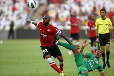ABU DHABI , UNITED ARAB EMIRATES Ð May 28 , 2013 : Grafite ( no 23 red ) of Al Ahli and Hassan Ibrahim ( no 26 green ) of Al Shabab in action during the President Cup final match between Al Ahli vs Al Shabab at Mohammed Bin Zayed Stadium in Abu Dhabi.  ( Pawan Singh / The National ) For Sports