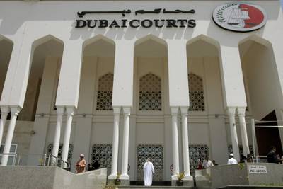 A closeup shot shows the facade of the Dubai Courts building during a hearing on April 04, 2010 in the case of a British couple sentenced to a month in jail after being convicted of kissing in public in a restaurant in the Muslim Gulf emirate. The couple's lawyer said the appeals court upheld the one-month prison sentence against the two, named by the British press as Ayman Najafi, 24, a British expat, and tourist Charlotte Lewis, 25. The couple were arrested in November 2009, after they were accused of consuming alcohol and kissing in a restaurant in the trendy Jumeirah Beach Residence neighbourhood.     AFP PHOTO/STR / AFP PHOTO