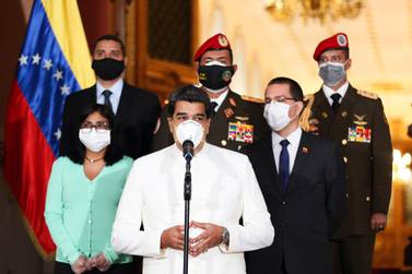 epa08333222 A handout photo made available by Miraflores Presidential Palace shows Venezuelan President Nicolas Maduro (C, bottom) wearing a mask while he makes a statement accompanied by Venezuelan Vice President Delcy Rodriguez (L) and Venezuelan Minister of Foreign Affairs Jorge Arreaza (2-R) at Miraflores Palace in Caracas, Venezuela, 30 March 2020. EPA/MIRAFLORES PRESIDENTIAL PALACE HANDOUT HANDOUT EDITORIAL USE ONLY/NO SALES
