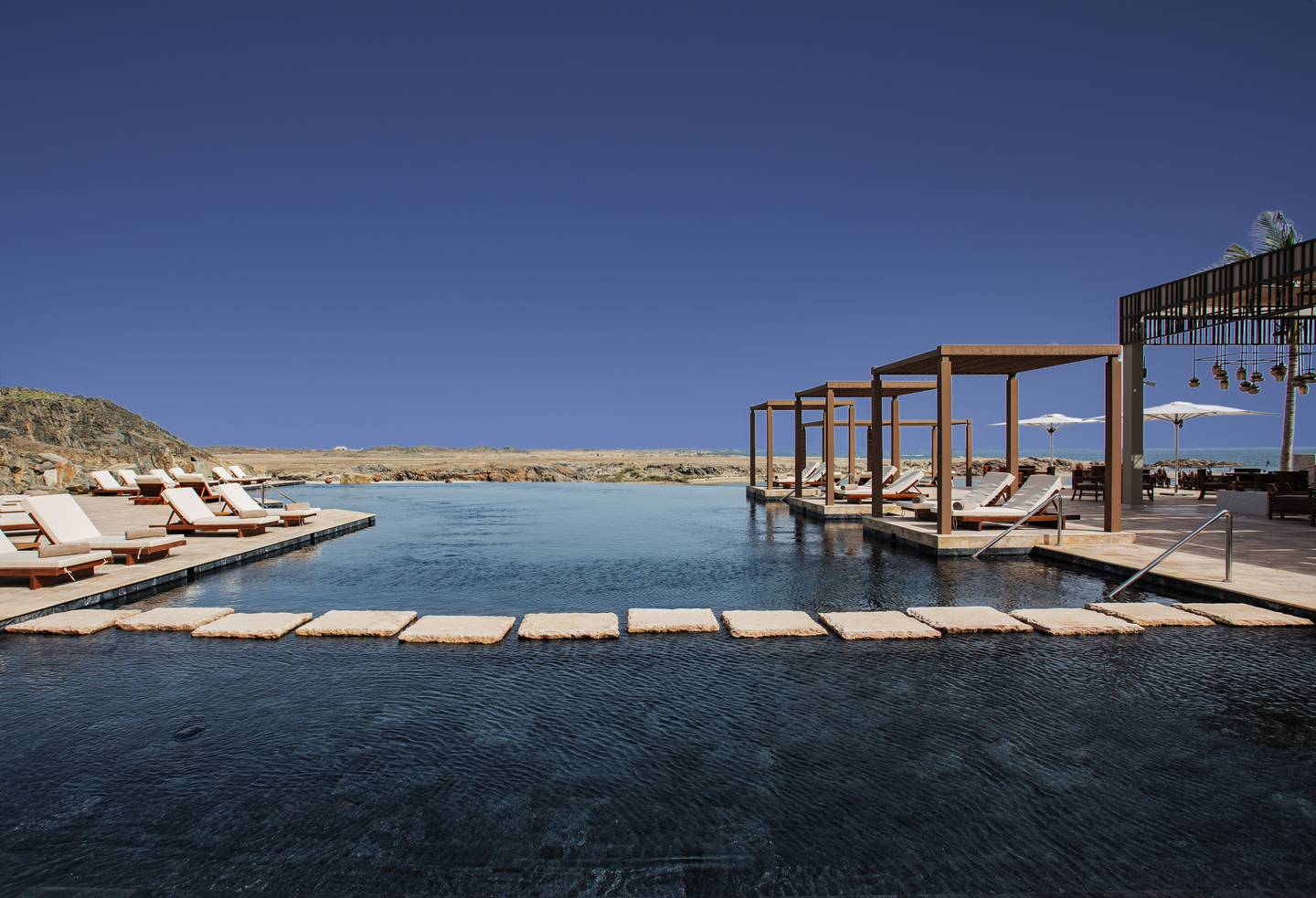 The SeaSalt pool offers dramatic water and wadi views.