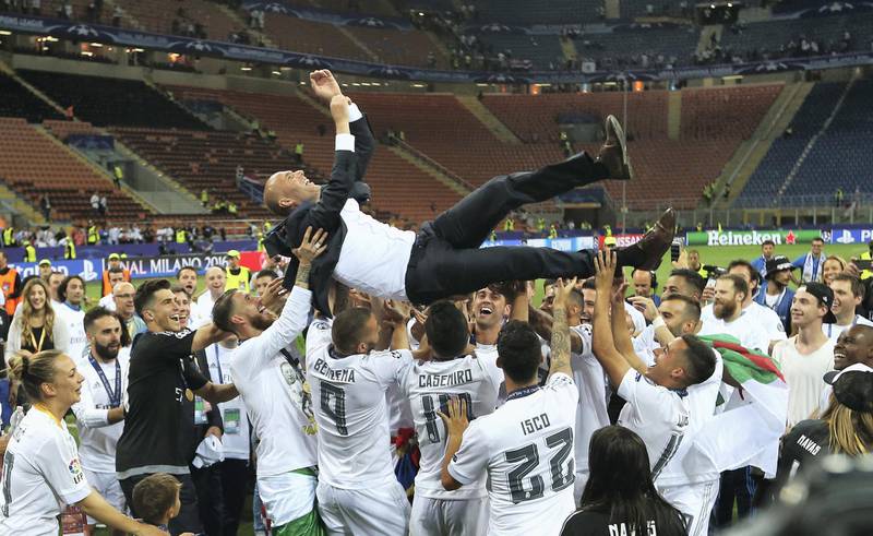 MILAN, ITALY - MAY 28:  Zinedine Zidane manager of Real Madrid is thrown in the air by the players after the UEFA Champions League Final between Real Madrid and Club Atletico de Madrid at Stadio Giuseppe Meazza on May 28, 2016 in Milan, Italy.  (Photo by Jan Kruger - UEFA/UEFA via Getty Images)