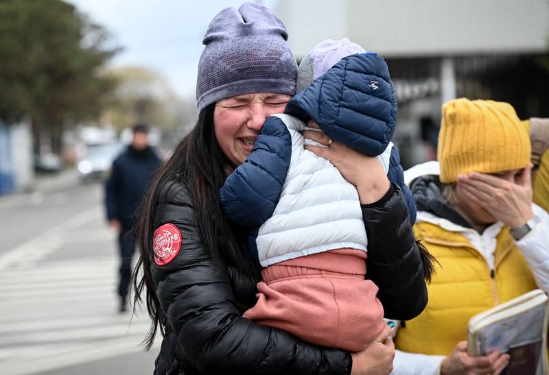 A Ukrainian refugee clings to her child, unable to hold back the despair of upheaval as she arrives at the Romanian border. The number of Ukrainian refugees who have fled has exceeded the 5 million mark as the war enters its ninth week, UN data has indicated. AFP