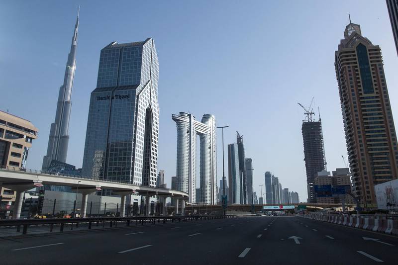 The deserted streets of Dubai with the Burj Khalifa in the background during April.  EPA