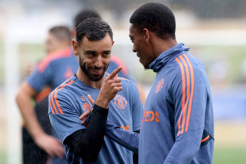 Manchester United midfielder Brun Fernandes, left, talks to teammate Anthony Martial during a training session in Perth on July 21, 2022, ahead of their tour match against Aston Villa. AFP