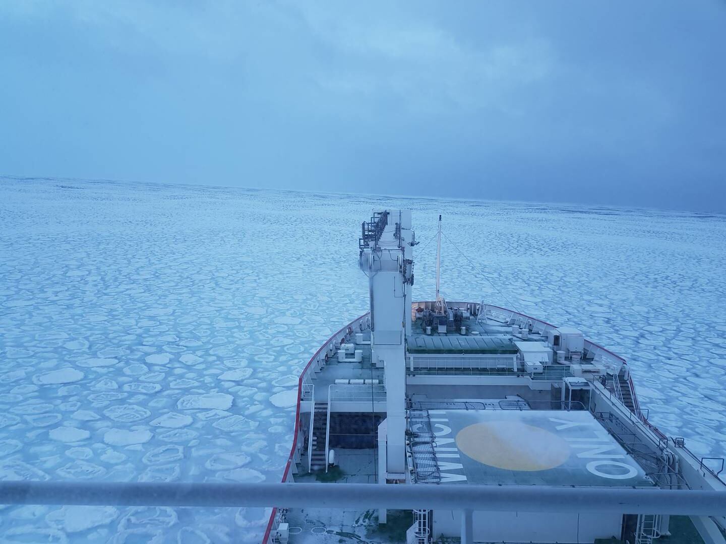 Researchers travel through sea ice in the Atlantic Southern Ocean aboard the S. A. Agulhas II, a South African icebreaking polar supply and research ship in the winter of 2017. Courtesy: Clare Eayrs