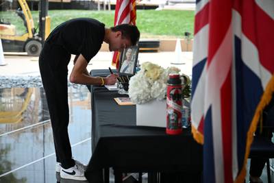 Benjamin Bruskin signs the condolence book in the lobby of the office building of the British consulate in Los Angeles. AFP