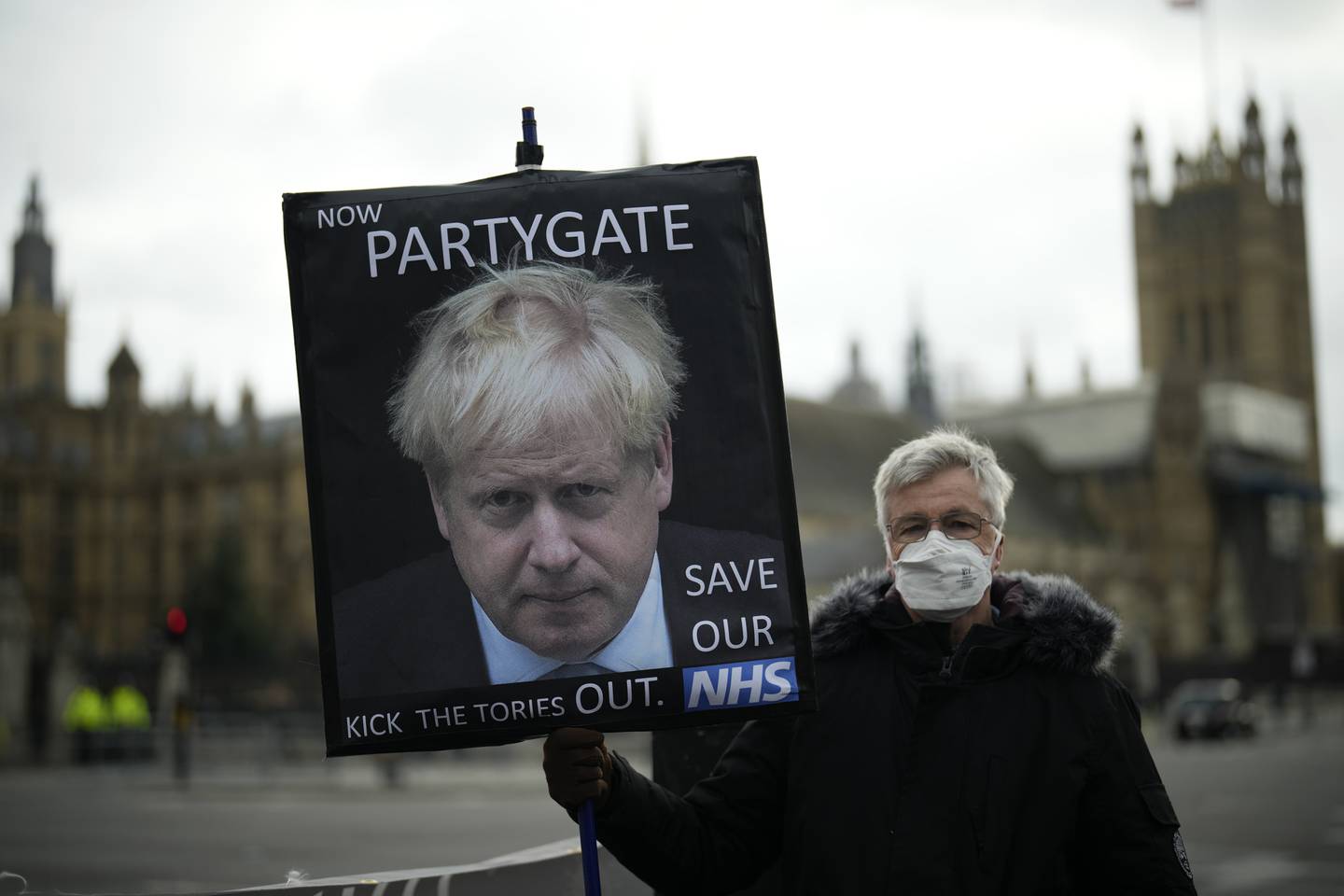 A protester by the Houses of Parliament, in London, Wednesday, December 8. AP 