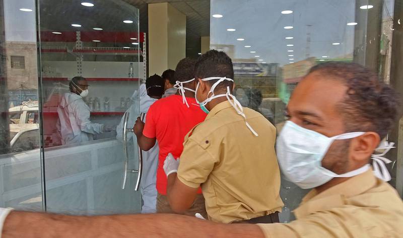 Health workers enter the Al Kubi Hospital in Yemen's southern coastal city of Aden. AFP