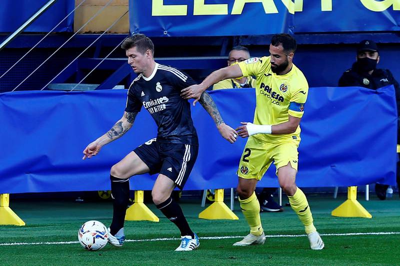 Villarreal's Mario Gaspar duels for the ball with Real Madrid's Toni Kroos. EPA